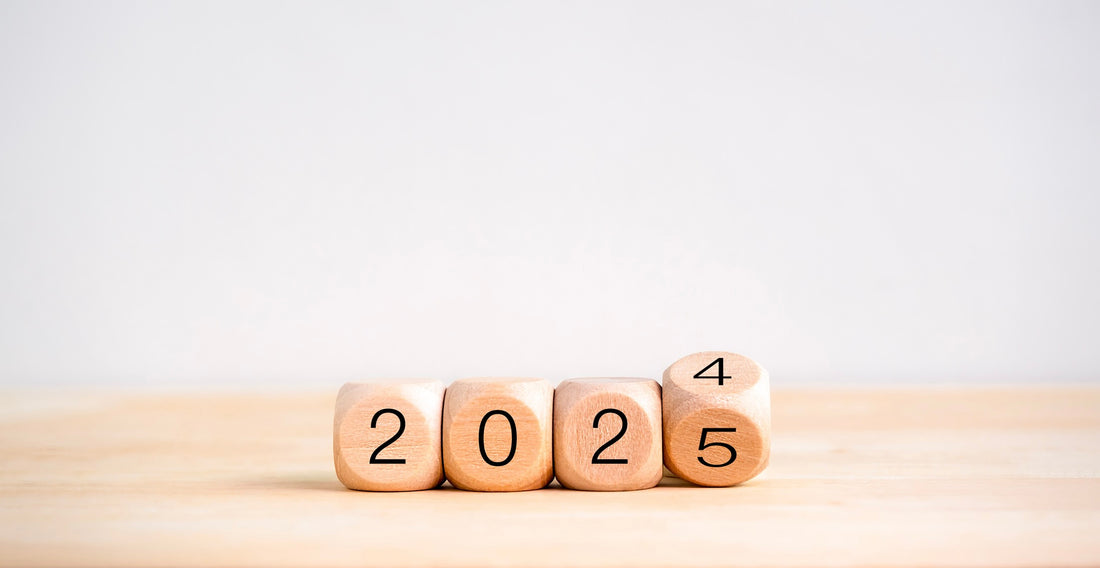 Wooden tiles that spell out "2025" with the "5" tile turning from a "4" in recognition of a new year.