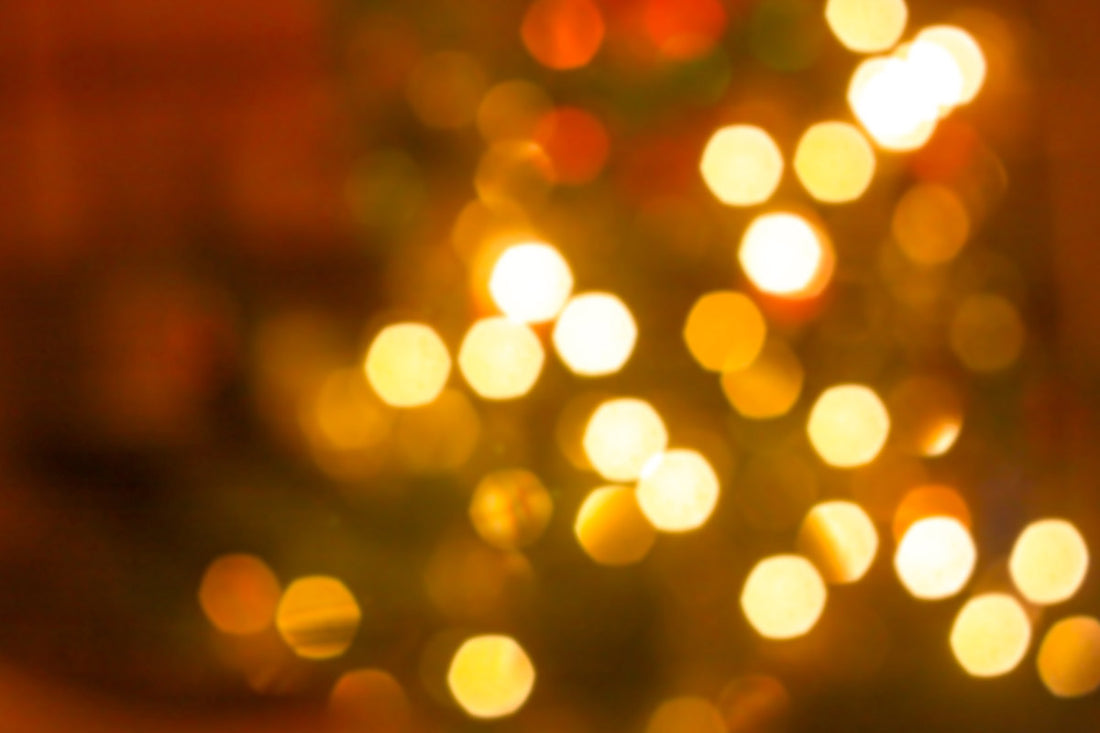 Yellow holiday lights blurred in an abstract image